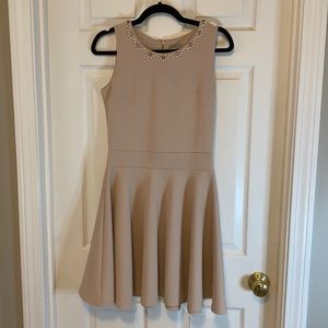 Cream colored A line dress with neckline detail